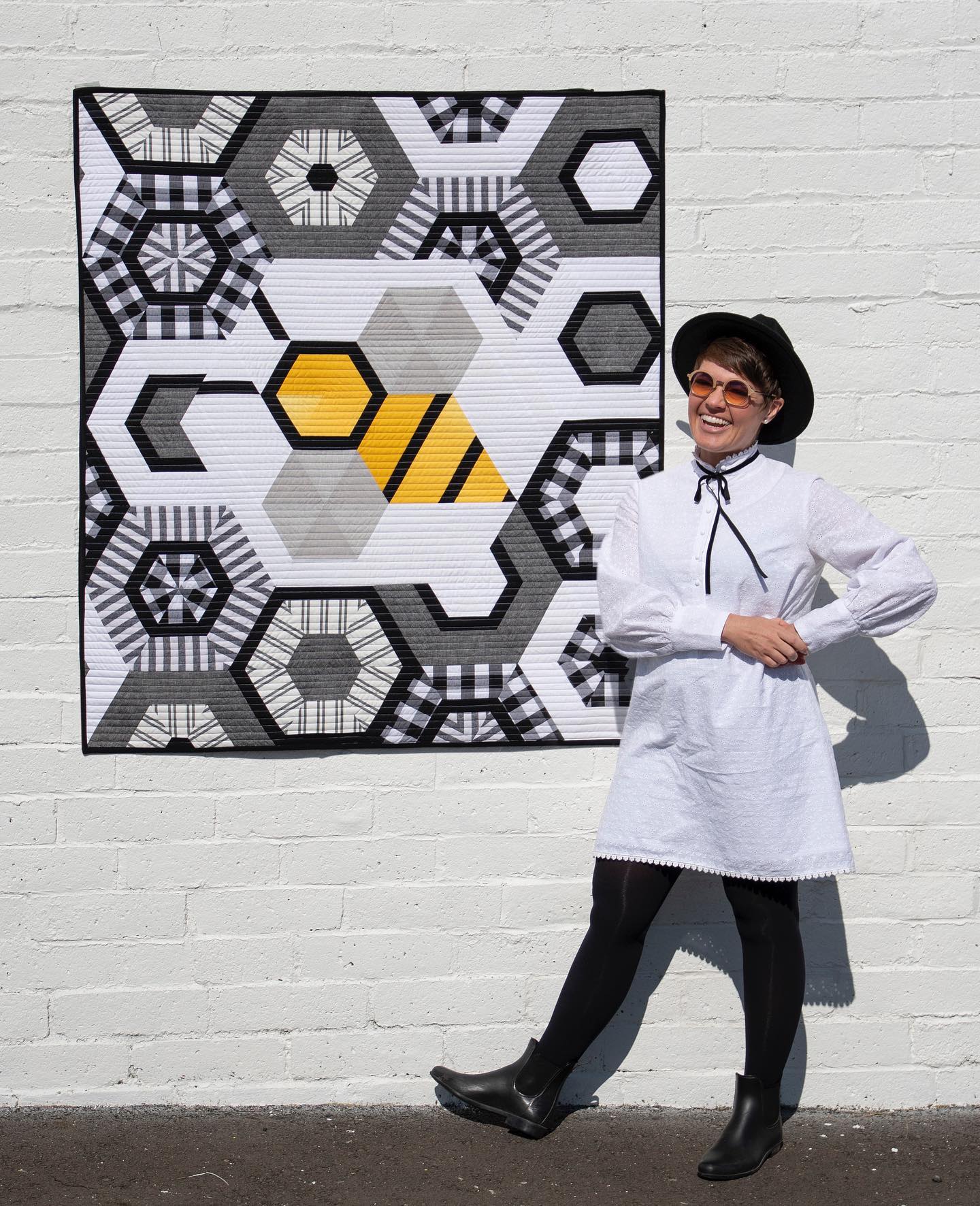 Photo of guest speaker, Krista Moser with Biggy the Bee quilt