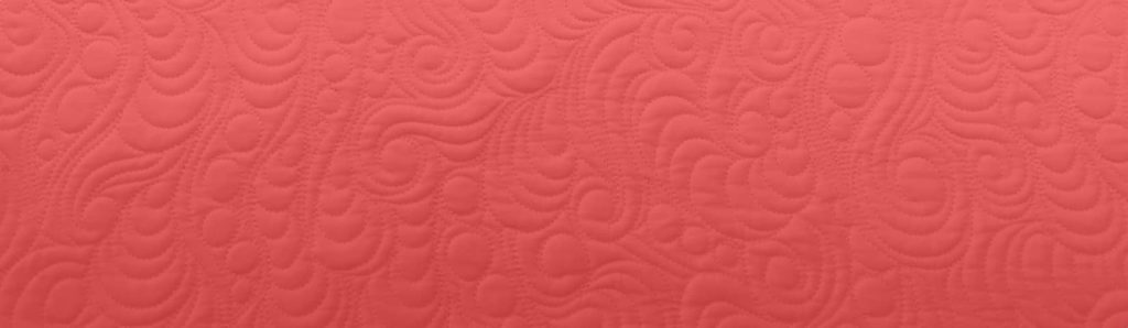 Texture of quilting on a red background