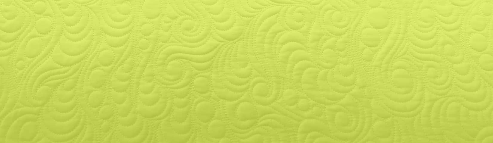 Texture of quilting on a chartreuse background